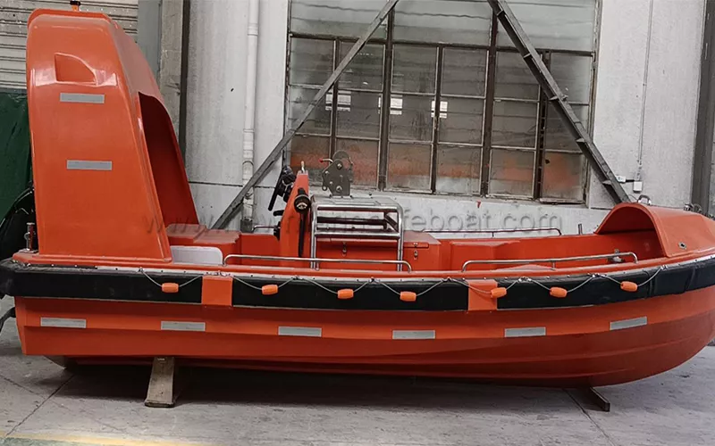 Fast rescue boat ready for emergency launch.png
